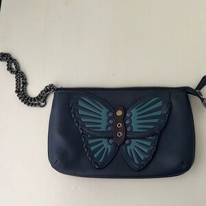 Coach wristlet with butterfly.  Gunmetal hardware.  Cute and functional!